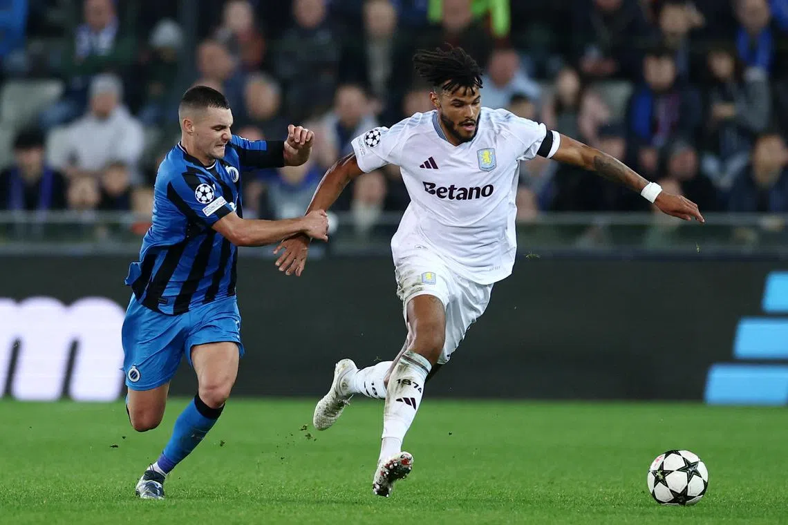 Aston Villa's Tyrone Mings (right) battling for the ball with Club Brugge's Ferran Jutgla in their Champions League clash.