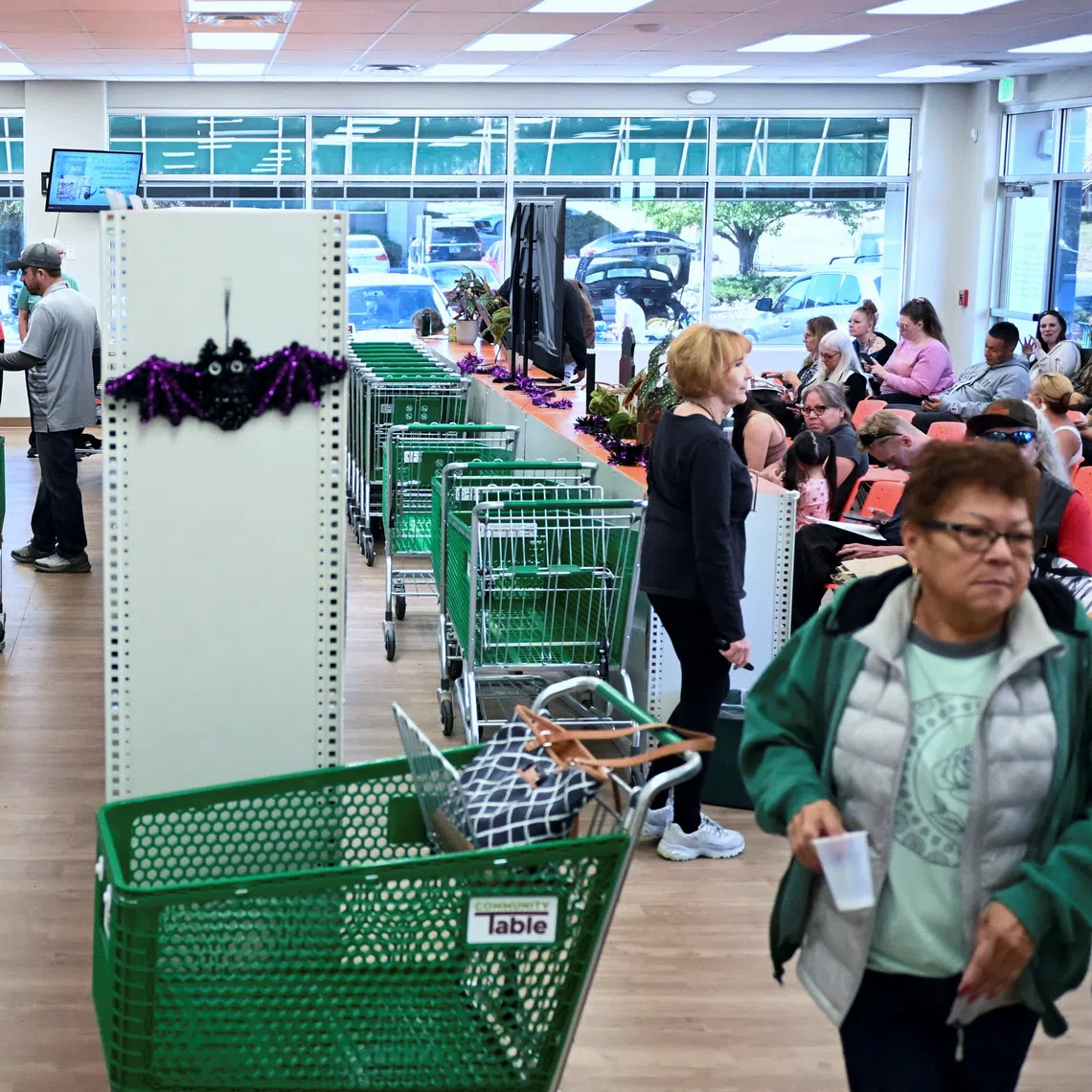 People select groceries at the Community Table food pantry, weeks into the continuing US government shutdown, in Arvada, Colorado, on Oct 22,
