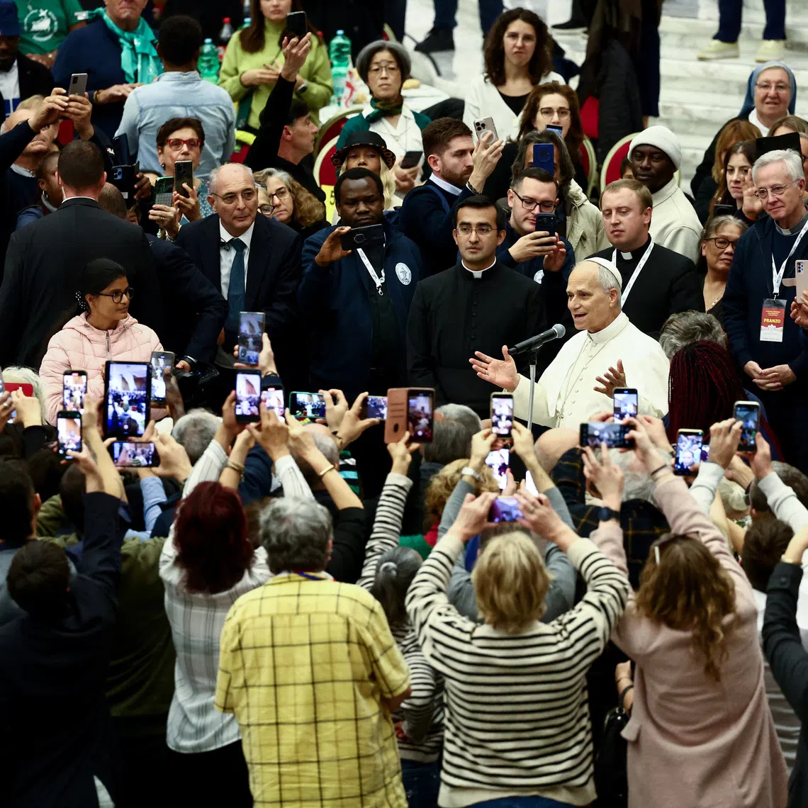Pope Leo XIV speaks on the day he participates in a lunch with poor people, on World Day of the Poor, in Paul VI Hall at the Vatican, November 16, 2025. REUTERS/Yara Nardi