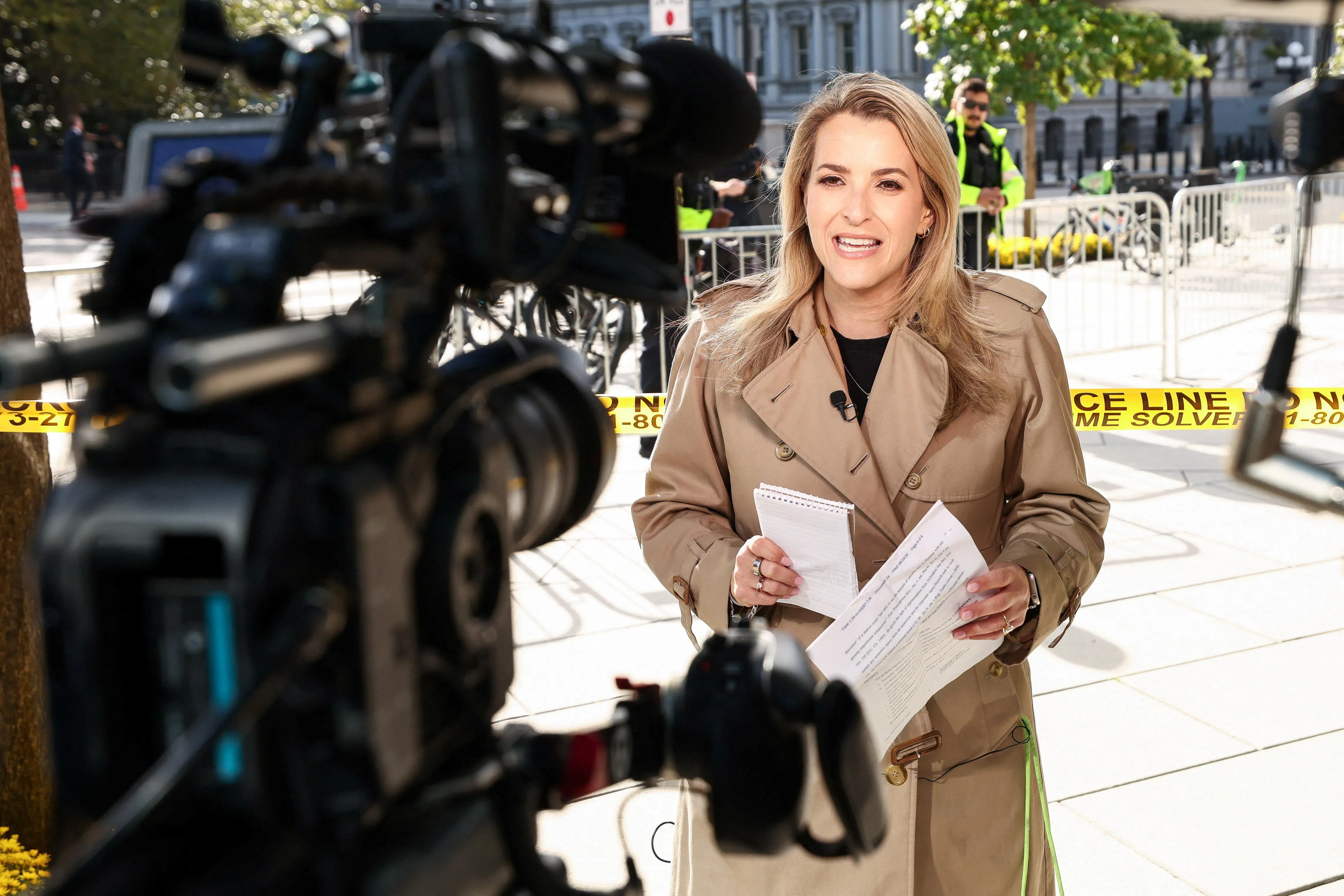 CNN White House correspondent Betsy Klein works near the White House, after reporters from CNN, Politico and MS NOW were barred from the White House on Thursday despite a judge's order calling for access to be restored immediately for them, after U.S. President Donald Trump banned the news outlets from the White House, in Washington, D.C., US, September 24, 2026. Betsy Klein and her crew were turned away from the White House this morning. REUTERS/Kevin Lamarque