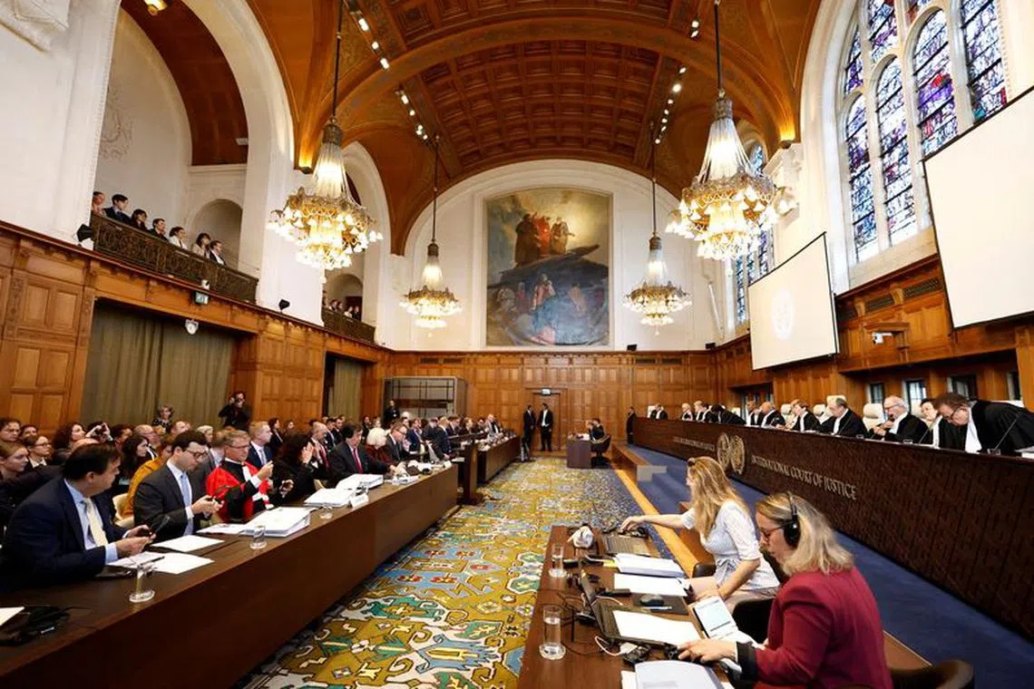 Members of the World Court listen as Russia begins presenting its objections against the jurisdiction of the World Court in a genocide case brought by Ukraine which claims Moscow falsely applied genocide law to justify its February 24, 2022 invasion, in The Hague, Netherlands, September 18, 2023. REUTERS/Piroschka van de Wouw/File Photo