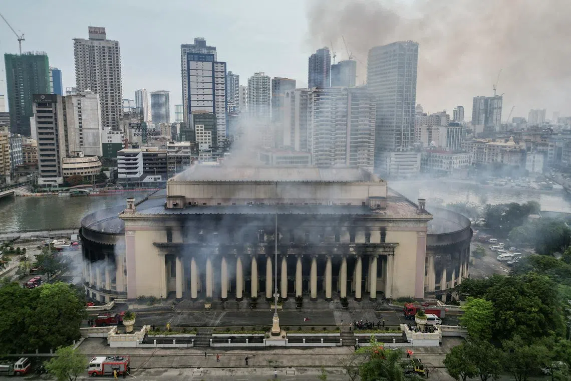 Smoke rises from the burning Manila Central Post Office building after a massive fire, in Manila, Philippines, May 22, 2023. 
