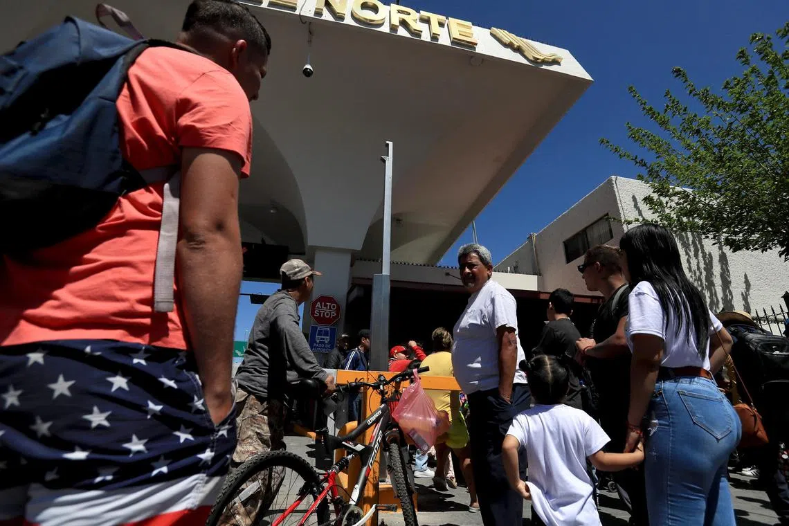 Migrants waiting to cross the border at the Paso del Norte bridge in Ciudad Juarez, Mexico. 