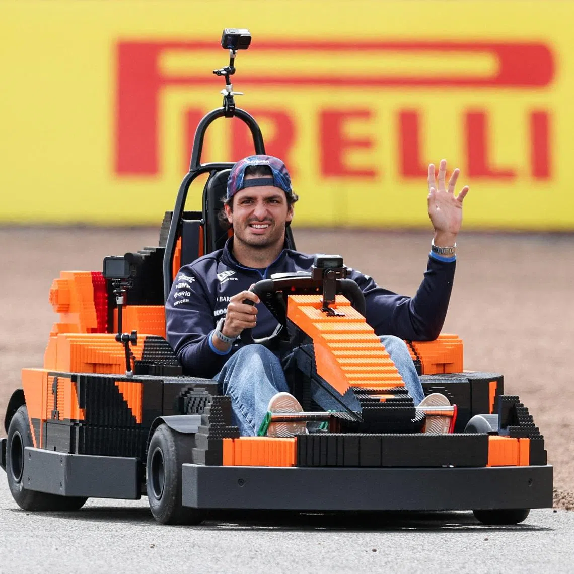 Formula One F1 - British Grand Prix - Silverstone Circuit, Silverstone, Britain - July 5, 2026 Williams' Carlos Sainz Jr. in a car made of Lego blocks ahead of the race REUTERS/Andrew Boyers