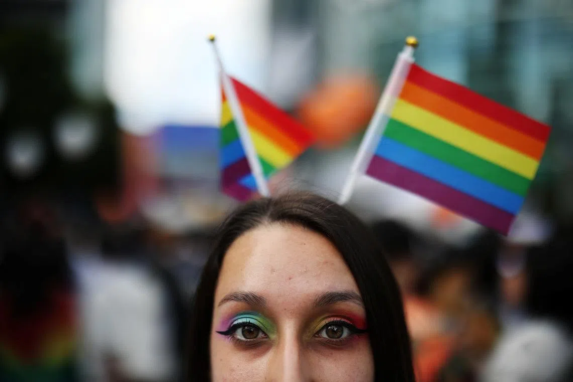 FILE PHOTO: A participant poses for photographs during the Seoul Queer Culture Festival in Seoul, South Korea, June 1, 2024.   REUTERS/Kim Hong-Ji/File Photo