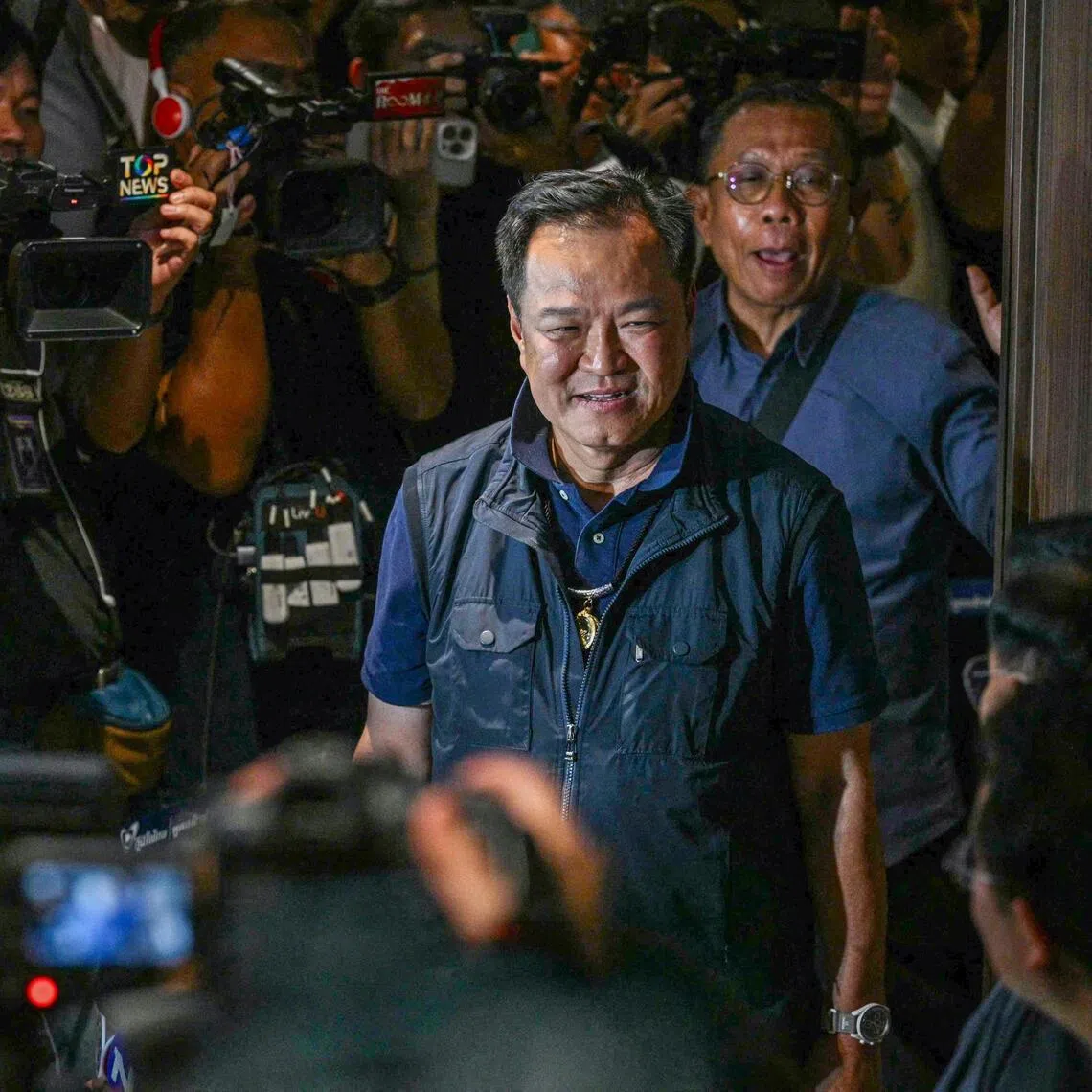 Thailand's Prime Minister and Bhumjaithai Party leader Anutin Charnvirakul arrives at his party's headquarters on election day in Bangkok.