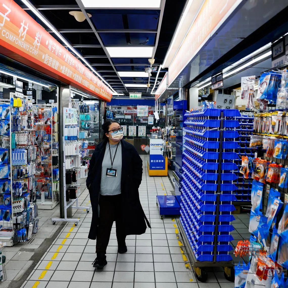 A customer checks out an electronics hardware store in Taipei, Taiwan April 3, 2025. REUTERS/Ann Wang
