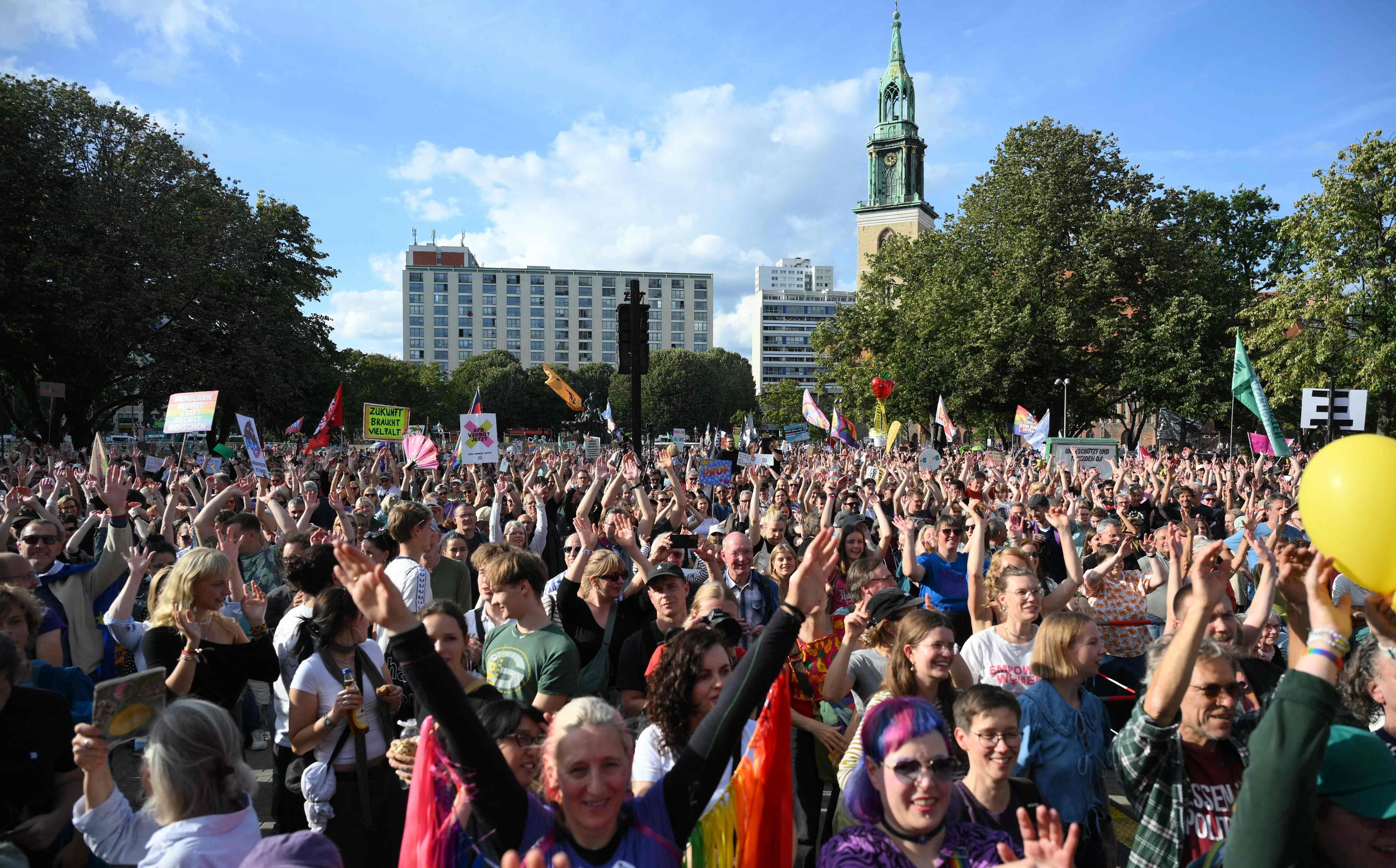 Protesters take part in a demonstration against the far-right in Berlin, on September 12, 2026. In the eastern state of Saxony-Anhalt the far-right Alternative for Germany (AfD) romped to victory with 44 percent of the vote, the highest figure for a nationalist party since 1945. (Photo by RALF HIRSCHBERGER / AFP)