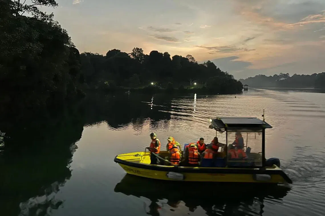 Gurkha search team traversing across reservoir on a PUB Boat.