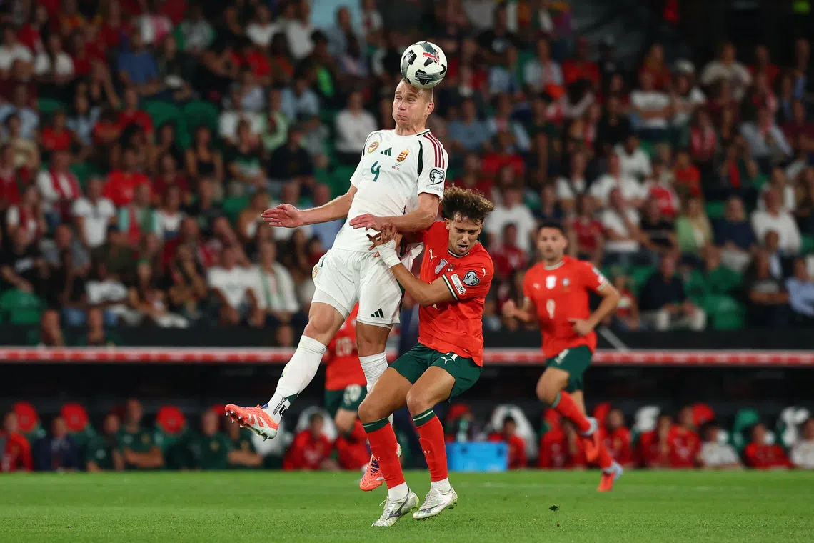 Soccer Football - FIFA World Cup - UEFA Qualifiers - Group F - Portugal v Hungary - Estadio Jose Alvalade, Lisbon, Portugal - October 14, 2025 Portugal's Joao Felix in action with Hungary's Attila Szalai REUTERS/Pedro Nunes