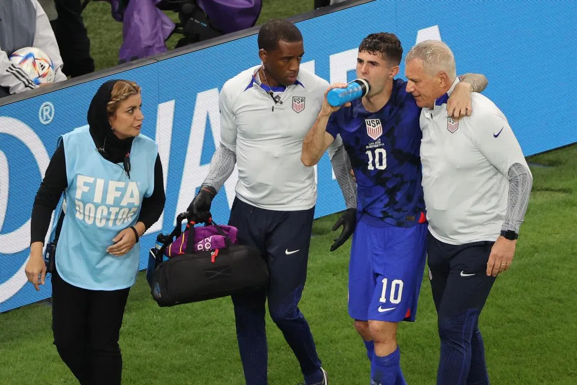 The United States medical staff assisting Christian Pulisic after he suffered an injury while scoring in the 1-0 World Cup win over Iran on Nov 29, 2022.