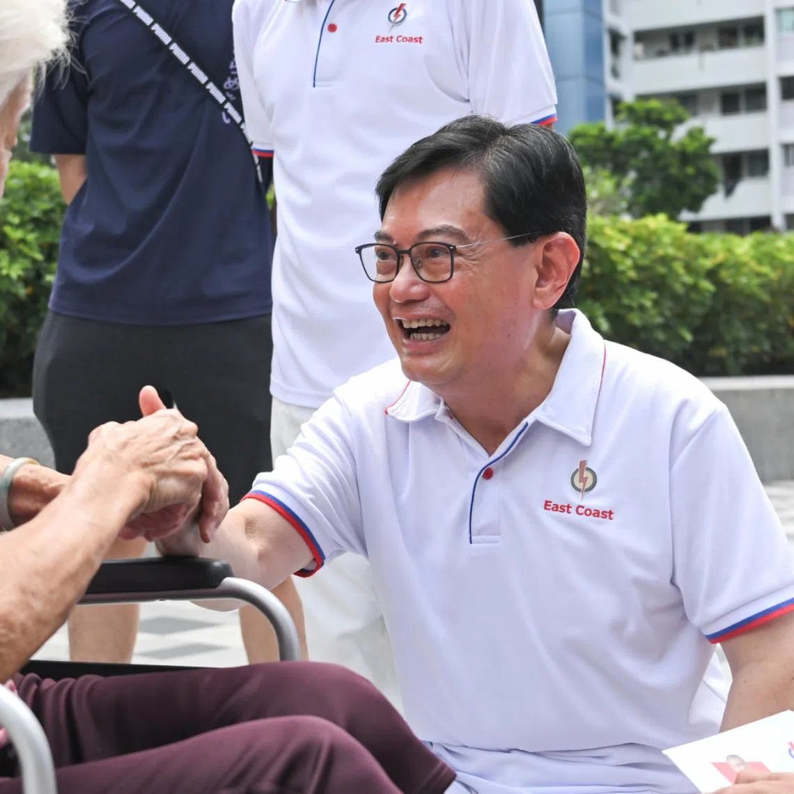 Deputy Prime Minister Heng Swee Keat greeting residents at a walkabout at Block 216 Bedok Food Centre on May 1.