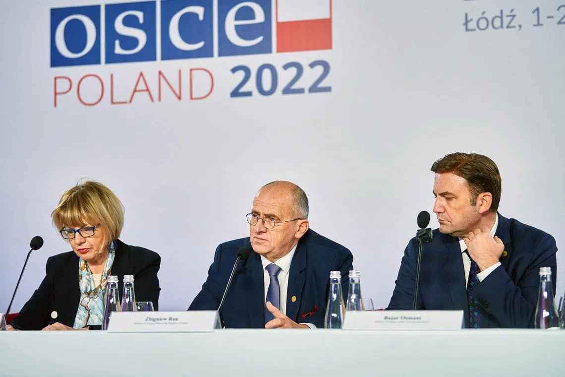OSCE Chairperson-in-Office and Polish Foreign Minister Zbigniew Rau (C), OSCE Secretary General Helga Maria Schmid and incoming OSCE Chairperson and North Macedonian Foreign Minister Bujar Osmani address a joint press conference at the end of the 29th Ministerial Council meeting of the OSCE (Organization for Security and Co-operation in Europe) in Lodz, Poland on December 2, 2022. (Photo by RADOSLAW JOZWIAK / AFP)