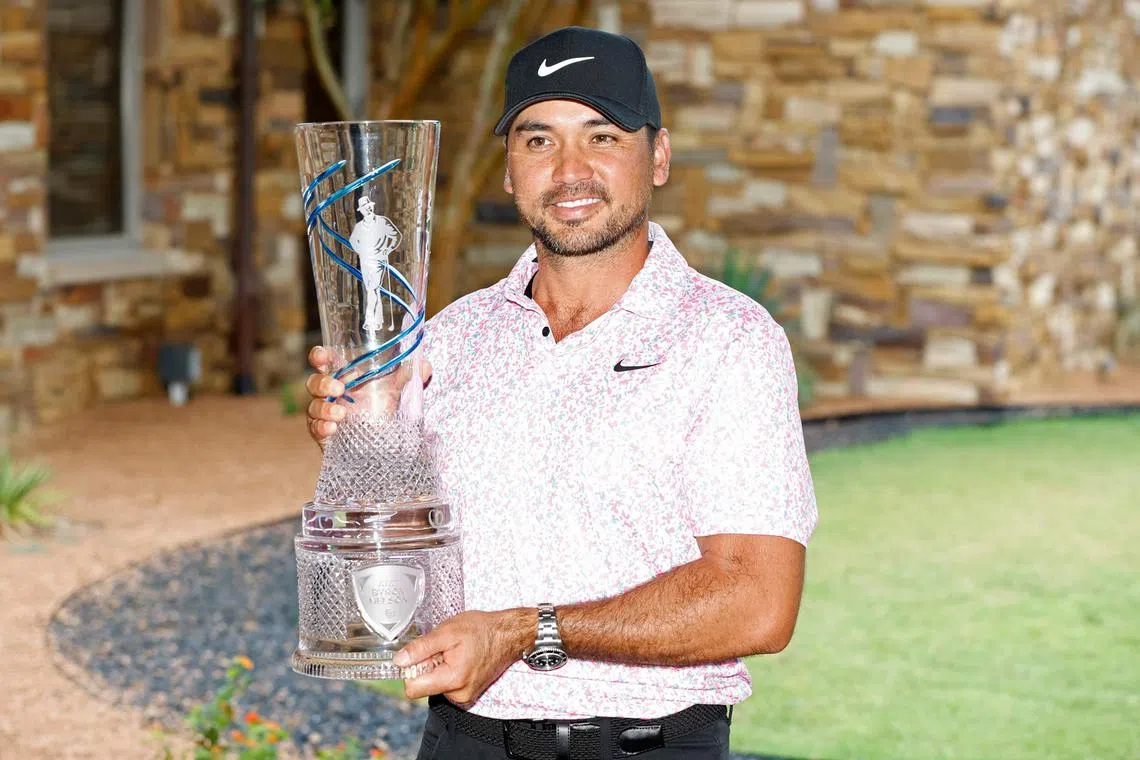 Jason Day of Australia posing with the trophy after winning the AT&T Byron Nelson tournament in Texas on Sunday. 