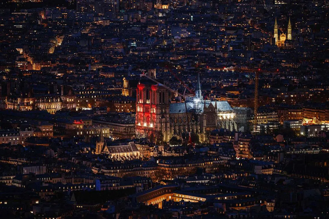 The Notre-Dame de Paris cathedral illuminated in red, as part of the Red Week, an event to raise awareness to the plight of the Christian population persecuted for their faith, in Paris on Nov 20, 2024. 