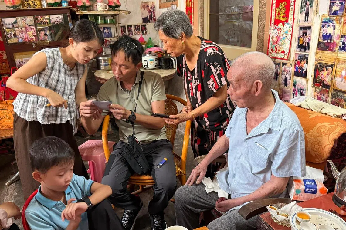 sftour - Mr Goh Mia Chun (centre) with his son, uncle Goh Lerng Hao (in blue) and relatives in his uncle's home.

Credit: Courtesy of Mr Goh Mia Chun