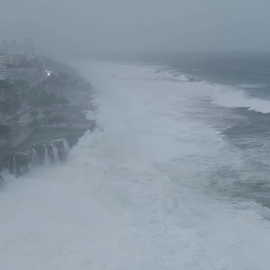 A drone view shows waves crashing on the Santo Domingo Boardwalk, in Santo Domingo, Dominican Republic July 2, 2024, in this screengrab obtained from a social media video. Instagram/@moises.arias06/via REUTERS