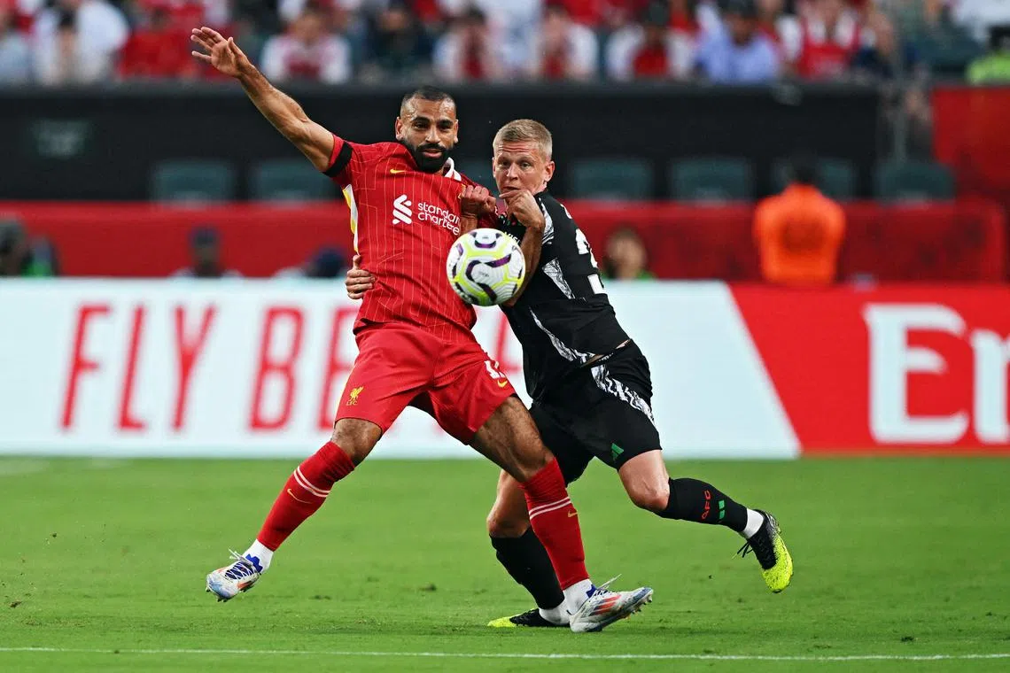 Liverpool's Mohamed Salah challenging for the ball with and Oleksandr Zinchenko of Arsenal during their friendly on July 31 in Philadelphia, Pennsylvania.