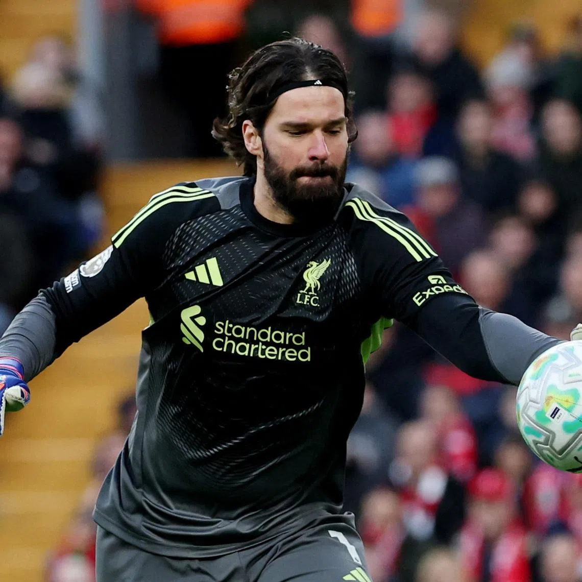 Soccer Football - Premier League - Liverpool v Tottenham Hotspur - Anfield, Liverpool, Britain - March 15, 2026 Liverpool's Alisson Becker in action REUTERS/Phil Noble