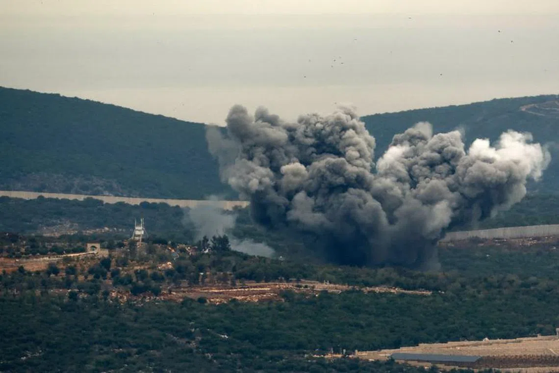 FILE PHOTO: Smoke rises as seen from Israel-Lebanon border in northern Israel, November 12, 2023. REUTERS/Evelyn Hockstein/File photo