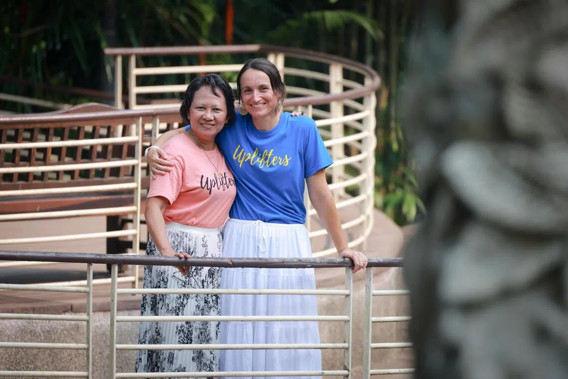 Evelyn Obillo, 47, a Filipina domestic helper (left) and Marie Kretz Di Meglio, the founder of Uplifters (Singapore) Limited (USL).