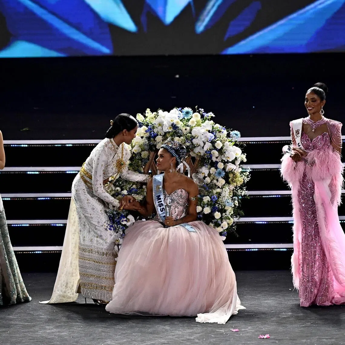 Taanusiya Chetty (right) appeared in a pink dress designed by Vietnamese fashion designer Minh Tuan Couture.