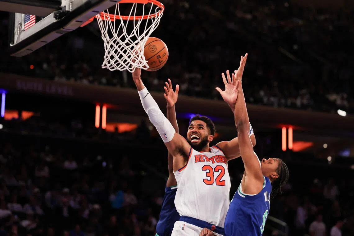 Karl-Anthony Towns going for the basket against Cody Williams of the Minnesota Timberwolves during their pre-season game at Madison Square Garden on Oct 12.
