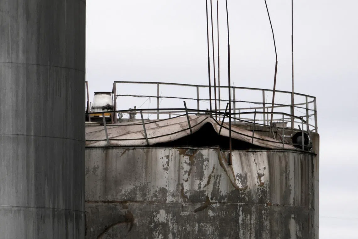 Damage to an oil tank after drones crashed at a storage facility in Rezekne, Latvia, May 7, 2026. REUTERS/Janis Laizans