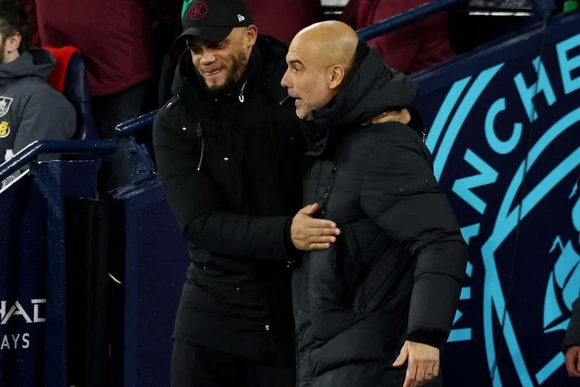 Soccer Football - Premier League - Manchester City v Burnley - Etihad Stadium, Manchester, Britain - January 31, 2024 Burnley manager Vincent Kompany and Manchester City manager Pep Guardiola before the match REUTERS/Phil Noble