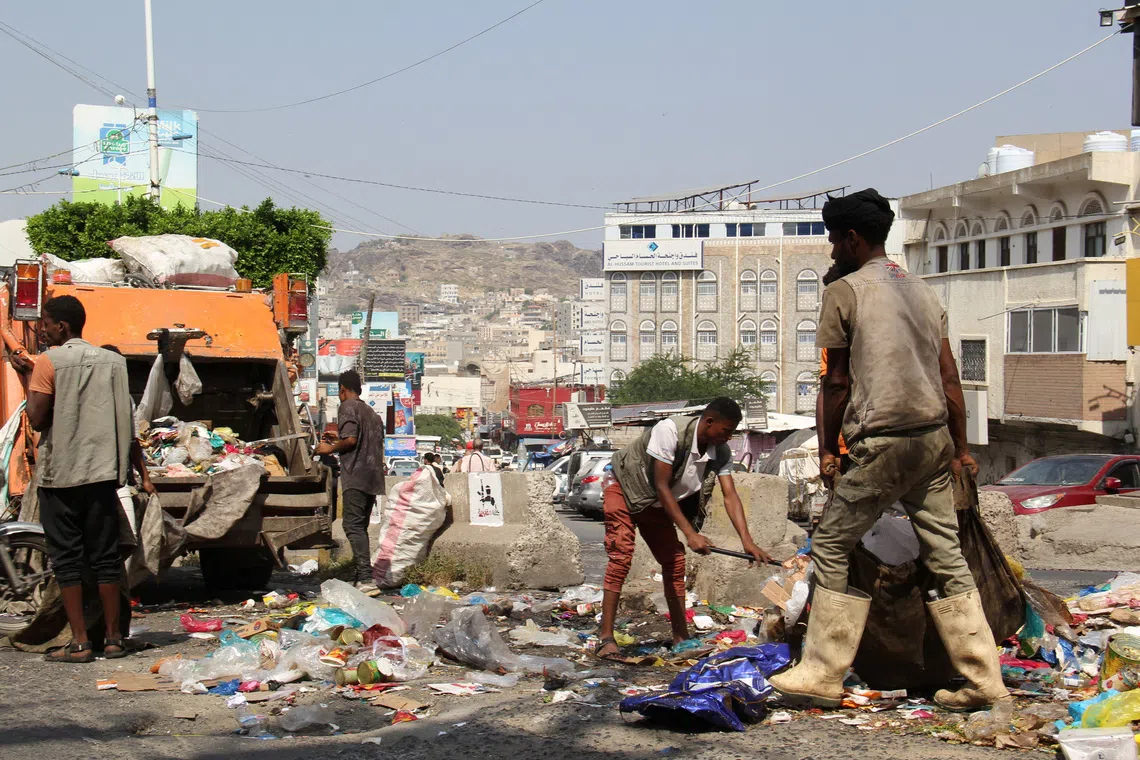 Workers collect garbage from a street in the southwestern city of Taiz, Yemen, October 20, 2026. REUTERS/Anees Mahyoub