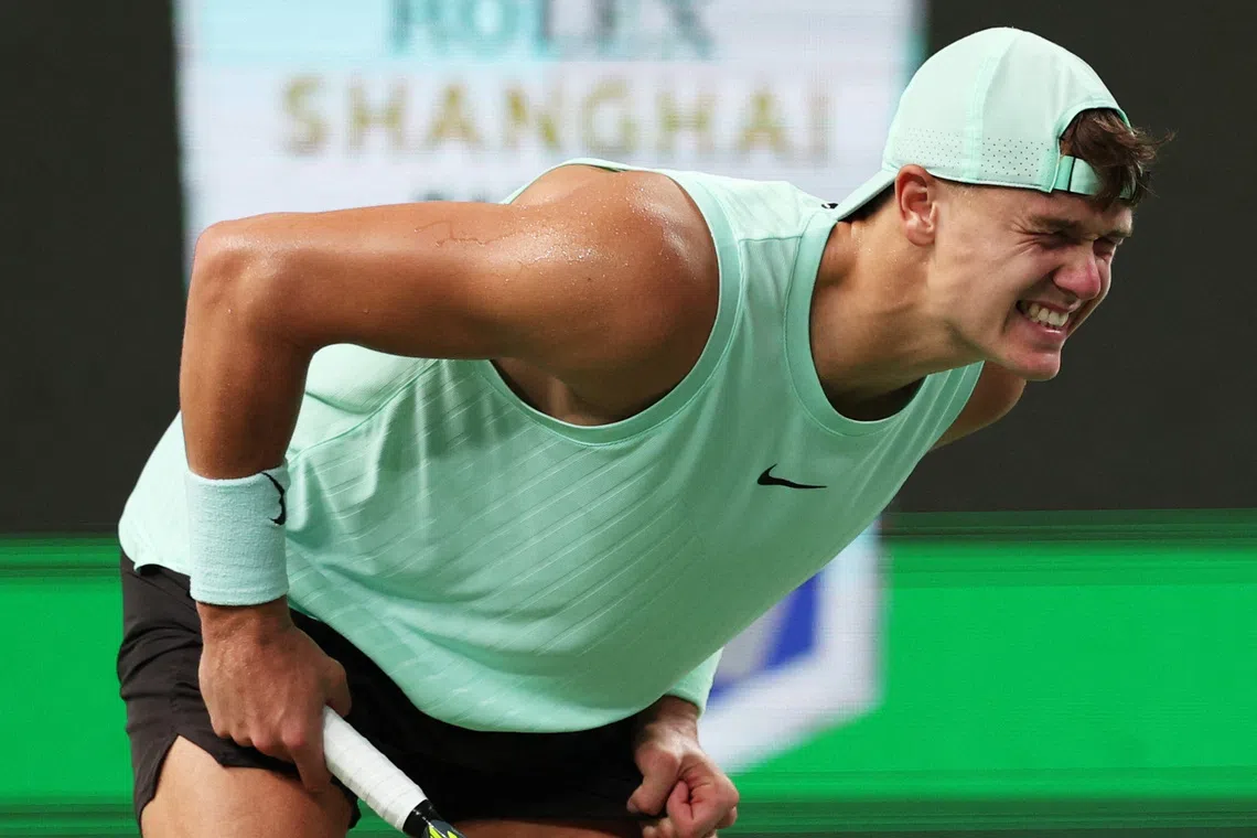 Tennis - ATP Masters 1000 - Shanghai Masters - Qizhong Forest Sports City Arena, Shanghai, China - October 9, 2025 Denmark's Holger Rune reacts after sustaining an injury during his quarter final match against Monaco's Valentin Vacherot REUTERS/Go Nakamura/File Photo