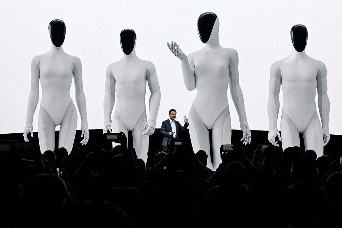 He Xiaopeng, cofounder and chairman of Chinese electric vehicle maker Xpeng, launches Xpeng's next-gen Iron humanoid robot during AI Day press conference at its headquarter in Guangzhou, in southern China's Guangdong province on Nov 5, 2025. 