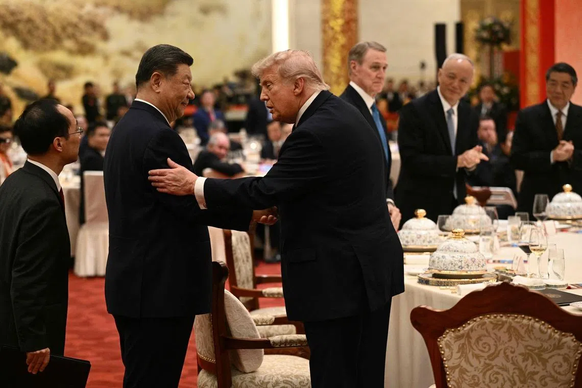 China's President Xi Jinping (left) and US President Donald Trump attend a state banquet at the Great Hall of the People in Beijing, on May 14.