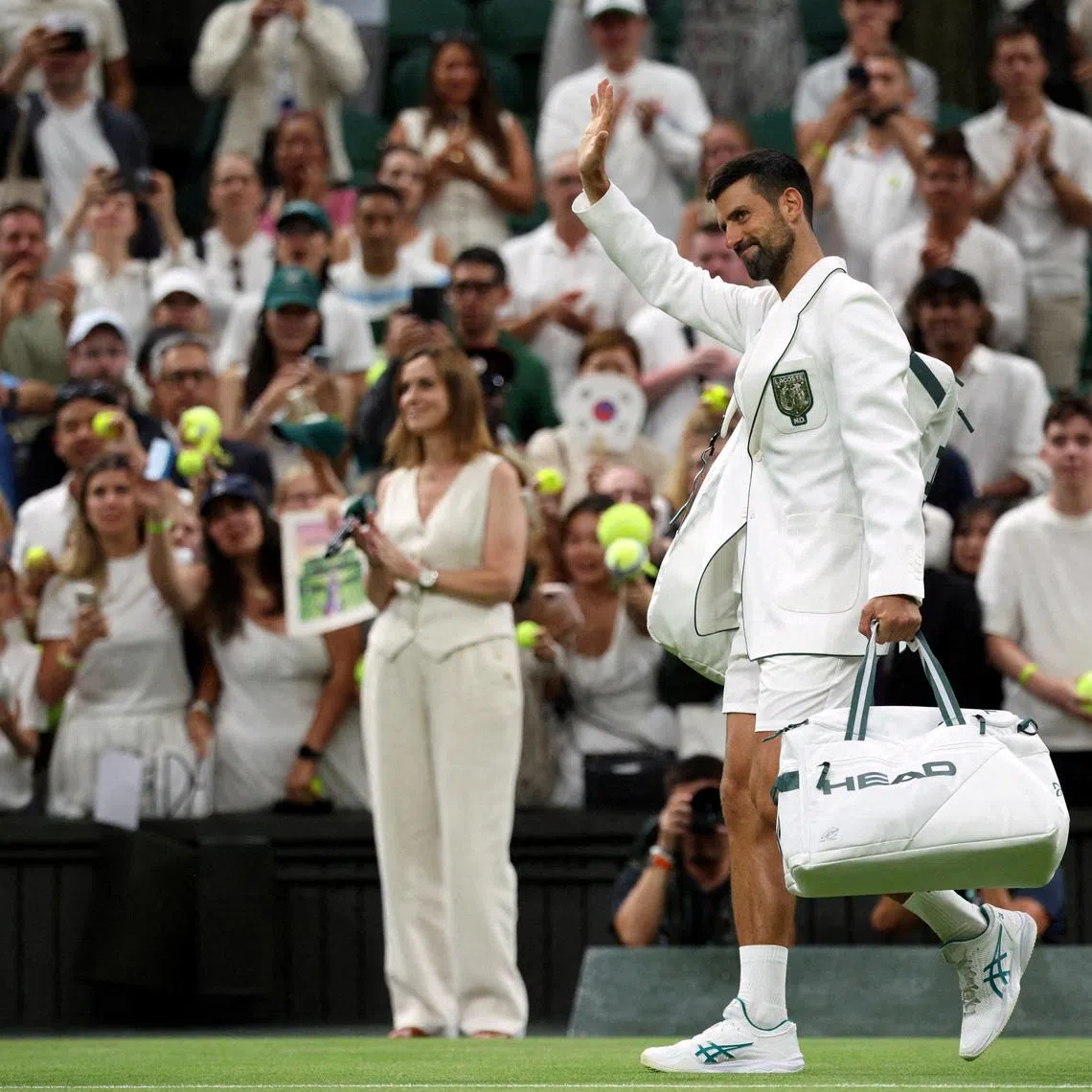 FILE PHOTO: Tennis - Wimbledon - All England Lawn Tennis and Croquet Club, London, Britain - July 1, 2026 Serbia's Novak Djokovic waves to the crowd as he leaves the court after winning his second round match against Greece's Stefanos Tsitsipas REUTERS/Marko Djurica/File Photo