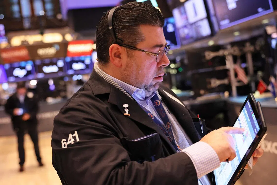 Traders work on the floor of the New York Stock Exchange.