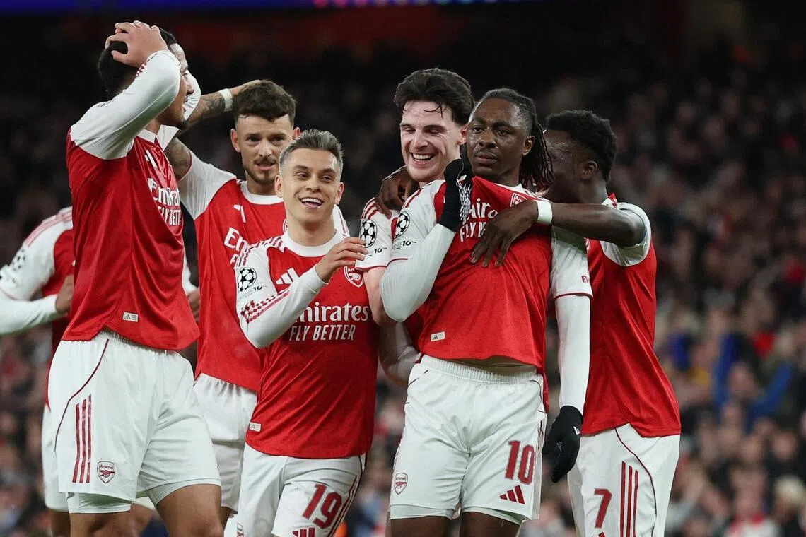 Arsenal's Eberechi Eze celebrates scoring their first goal with teammates.