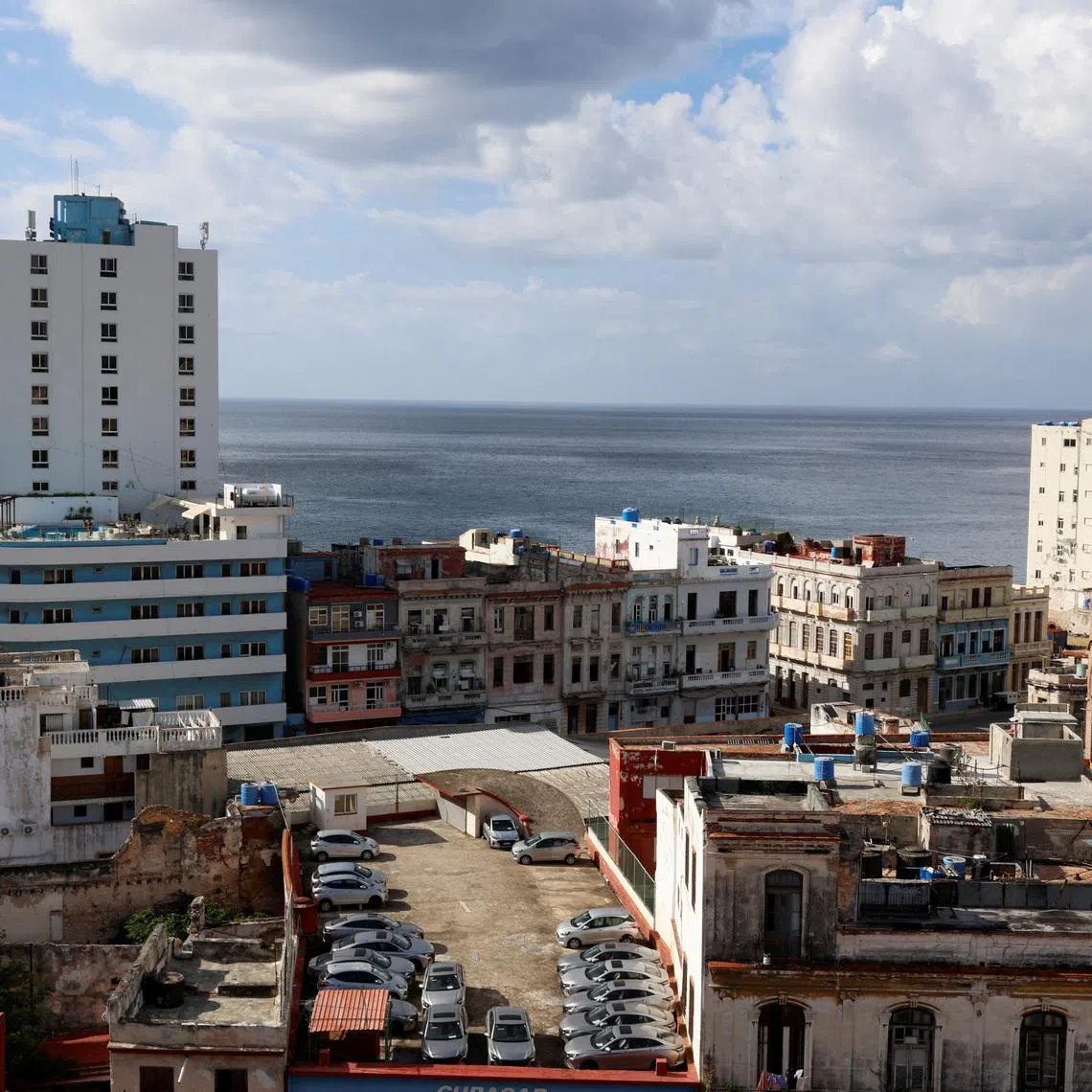 A parking lot for tourist rental cars on a rooftop amidst residential buildings before the Cuban government presents far-reaching economic measures that could mark the most significant shift toward a market economy since the 1959 revolution, in Havana, Cuba June 17, 2026. REUTERS/Norlys Perez
