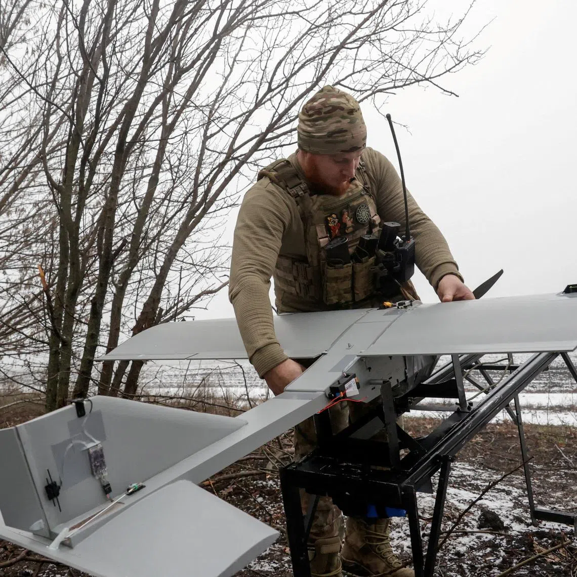 FILE PHOTO: A serviceman of the 66th Separate Mechanized Brigade named after Prince Mstyslav the Brave prepares to launch a Darts middle range strike unmanned aerial vehicle towards Russian troops from a position near a front line, amid Russia's attack on Ukraine, in Donetsk region, Ukraine December 16, 2025. REUTERS/Sofiia Gatilova/File Photo
