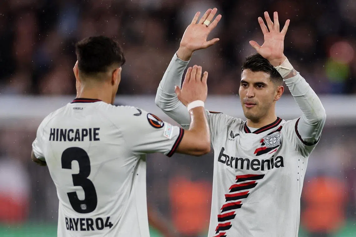 Soccer Football - Europa League - Quarter Final - Second Leg - West Ham United v Bayer Leverkusen - London Stadium, London, Britain - April 18, 2024 Bayer Leverkusen's Piero Hincapie and Exequiel Palacios celebrate after the match Action Images via Reuters/Paul Childs/File Photo