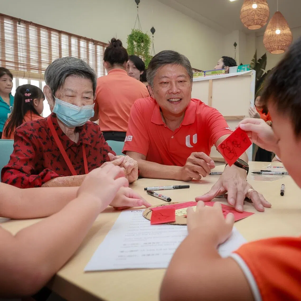 NTUC Secretary-General Ng Chee Meng, together with children from My First Skool at Braddell Heights Community Hub and seniors from NTUC Health Segangoon Central, penning wishes during the launch of the NTUC Community Fund on April 9, 2026.
