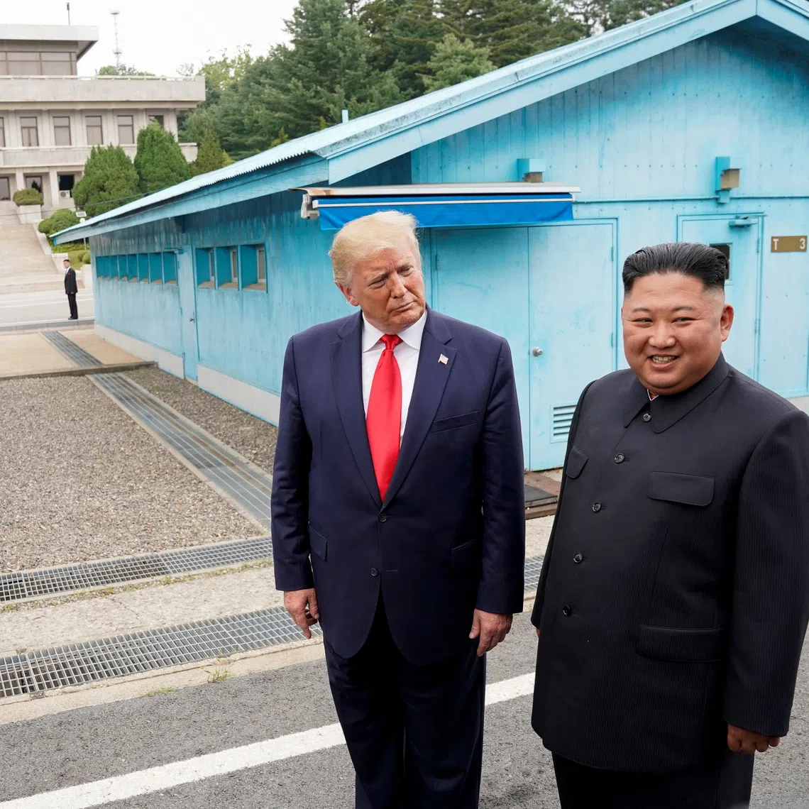 FILE PHOTO: U.S. President Donald Trump meets with North Korean leader Kim Jong Un at the demilitarized zone separating the two Koreas, in Panmunjom, South Korea, June 30, 2019. REUTERS/Kevin Lamarque/File Photo