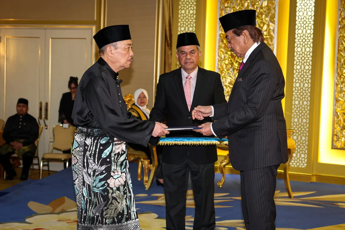 Datuk Seri Hajiji Noor (left) was sworn in as Sabah Chief Minister for a second term early this morning. 