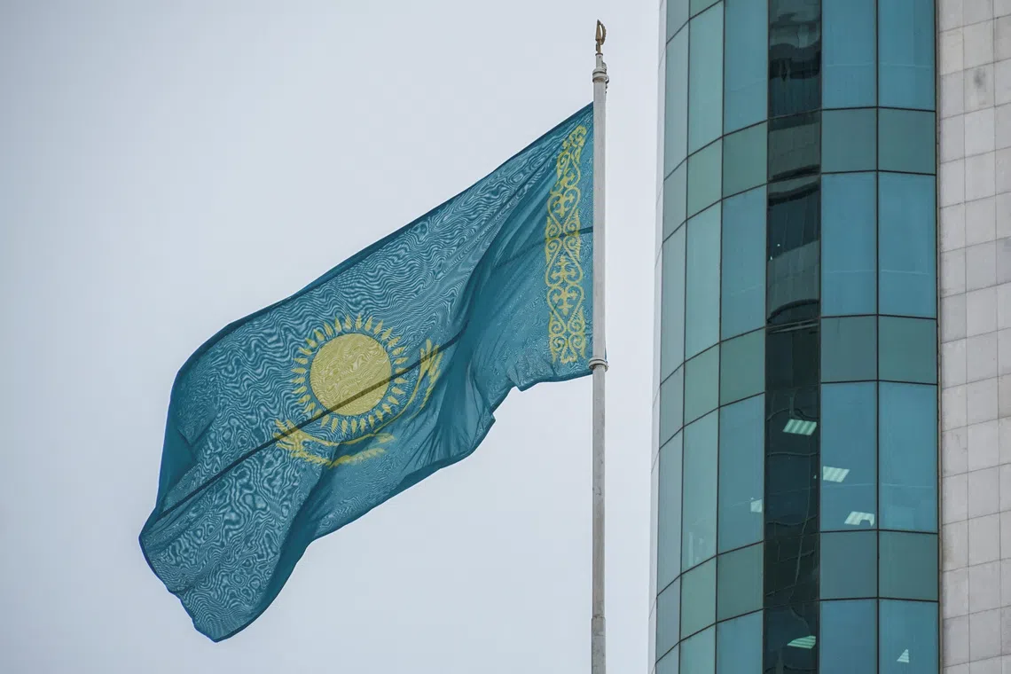Kazakhstan's national flag flies in front of a building of the Mazhilis, the lower house of Kazakhstan's Parliament, in Astana, Kazakhstan January 13, 2023.  REUTERS/Turar Kazangapov