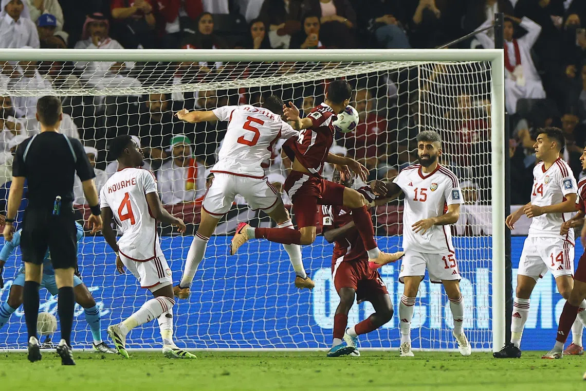 Soccer Football - FIFA World Cup - AFC Qualifiers - Group A - Qatar v United Arab Emirates - Jassim Bin Hamad Stadium, Doha, Qatar - October 14, 2025 Qatar's Boualem Khoukhi scores their first goal REUTERS/Ibraheem Al Omari