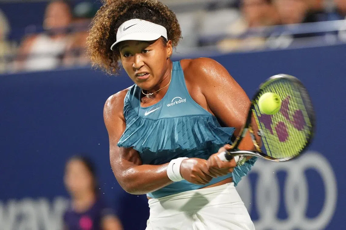 Japan's Naomi Osaka returning to Belgium's Elise Mertens in the Canadian Open second round at Sobeys Stadium in Toronto on Aug 8, 2024.