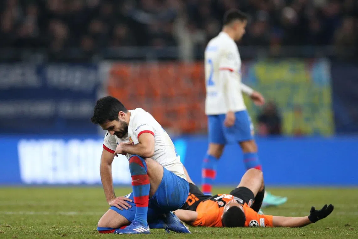 Barcelona's Ilkay Gundogan looks dejected after his team's Champions League loss to Shakhtar Donetsk.