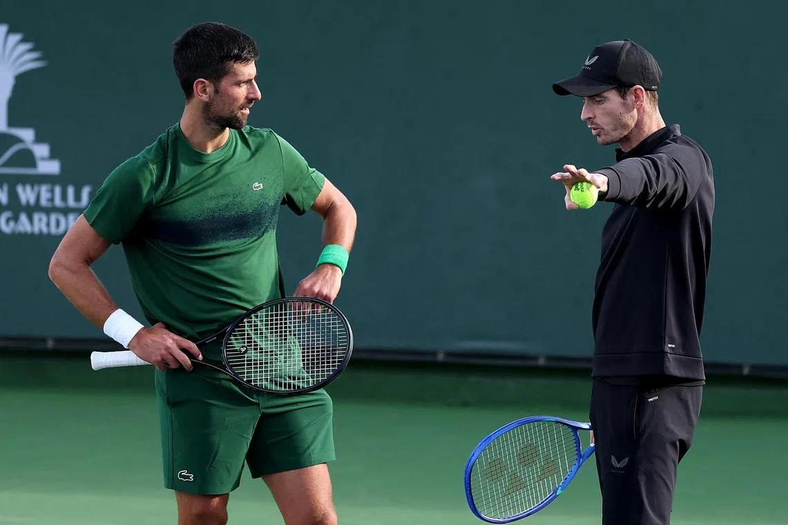Novak Djokovic (left) and coach Andy Murray working on his serve at the Indian Wells tournament in March.