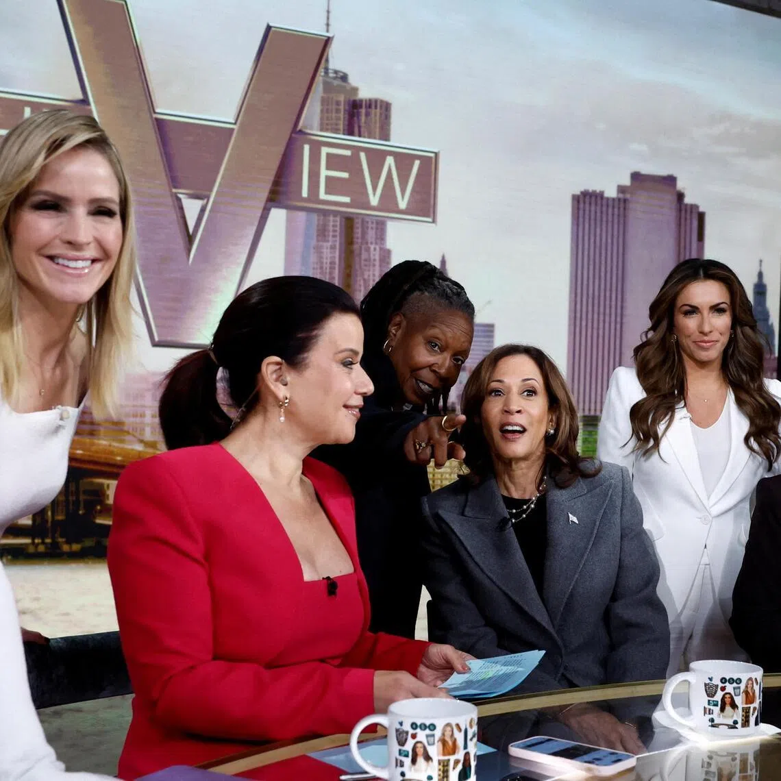 FILE PHOTO: Whoopi Goldberg gestures next to Democratic presidential nominee and U.S. Vice President Kamala Harris as they appear on ABC's "The View" in New York, U.S., October 8, 2024. REUTERS/Evelyn Hockstein/File Photo