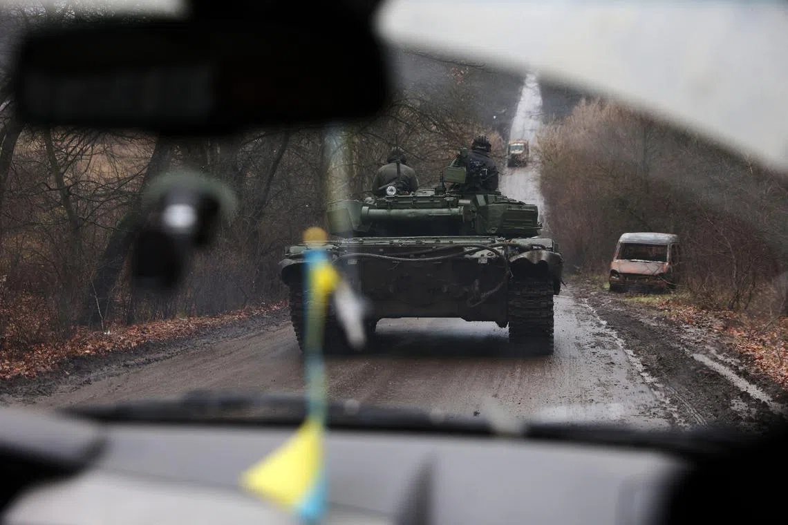 Ukrainian servicemen drive a tank in eastern Ukraine on Nov 22, 2022.