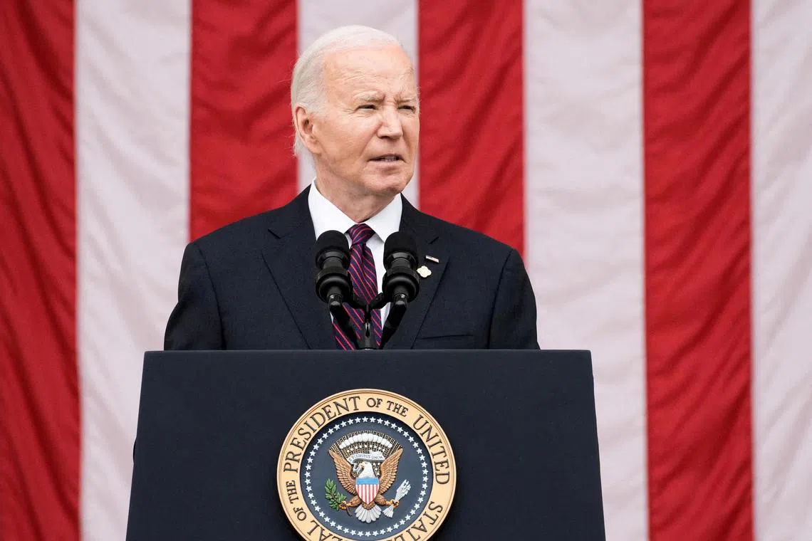 FILE PHOTO: U.S. President Joe Biden speaks during the National Memorial Day Wreath-Laying and Observance Ceremony at Arlington National Cemetery, in Arlington, Virginia, U.S., May 27, 2024. REUTERS/Ken Cedeno/File Photo